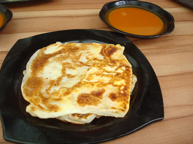This is a plate of marvellous roti prata.